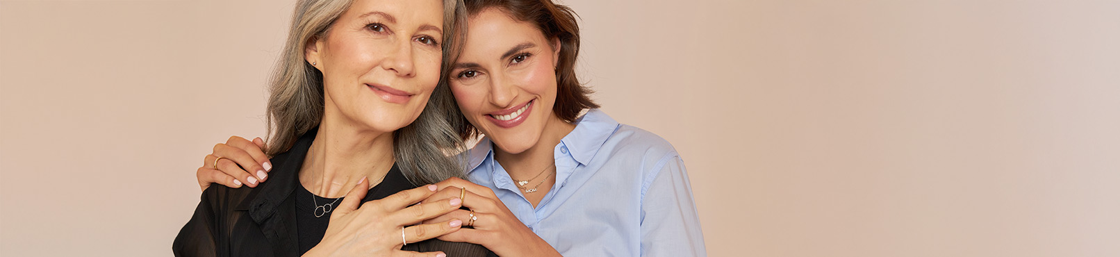two women, jewelry, rings, necklace, shirt